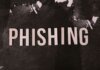 Abstract representation of phishing with the text on a textured dark surface.