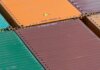 Aerial view of vibrant cargo containers arranged in a pattern, emphasizing logistics and transportation.