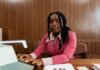 Канада выделила помощь Ливану и Иордании по итогам визита госсекретаря African American woman in a pink suit typing on a retro typewriter in an office setting.
