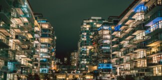 Captivating night view of illuminated high-rise buildings in North Vancouver's urban setting.