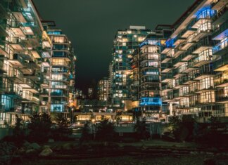 Captivating night view of illuminated high-rise buildings in North Vancouver's urban setting.