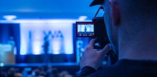Capturing a conference event with a focus on professional videography services.