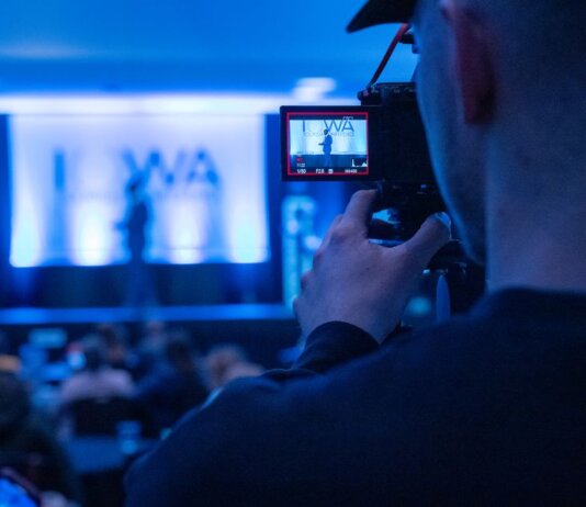 Capturing a conference event with a focus on professional videography services.
