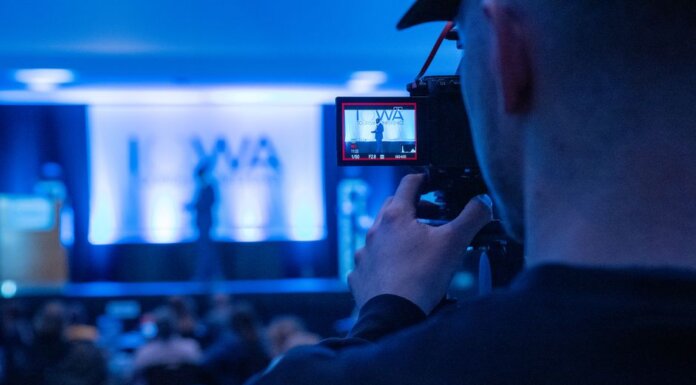 Capturing a conference event with a focus on professional videography services.