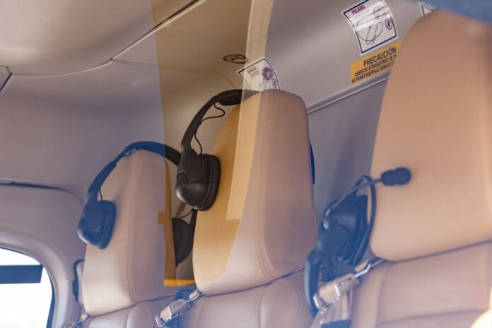 Close-up of a luxurious helicopter interior with leather seats and headphones. Close-up of a luxurious helicopter interior with leather seats and headphones.