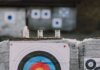 Канада вводит ответные пошлины и поддержку бизнеса из-за тарифов США Close-up of archery targets and steel cans used for target practice at an outdoor range.