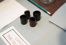 Консерваторы: риторика Карни не соответствует экономической реальности Close-up of film negatives and tools used in vintage photography development.