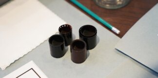 Close-up of film negatives and tools used in vintage photography development.