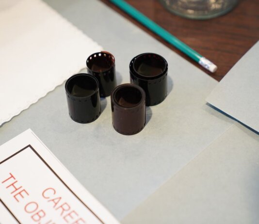 Close-up of film negatives and tools used in vintage photography development.