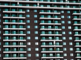 Close-up view of a modern apartment building facade with balconies in Montreal, Canada.