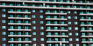 Close-up view of a modern apartment building facade with balconies in Montreal, Canada.