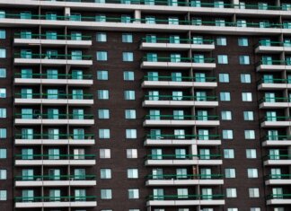Close-up view of a modern apartment building facade with balconies in Montreal, Canada.