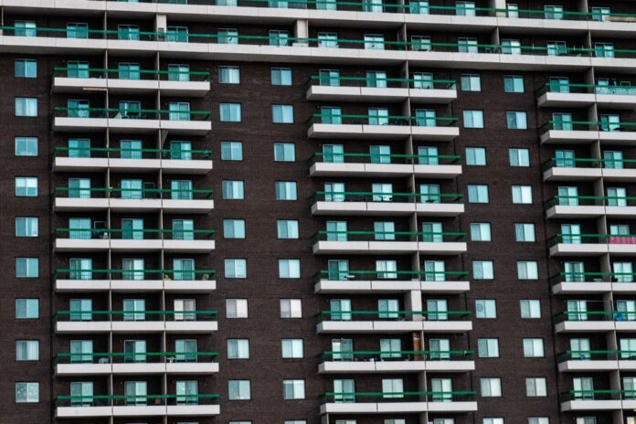 Close-up view of a modern apartment building facade with balconies in Montreal, Canada. Close-up view of a modern apartment building facade with balconies in Montreal, Canada.