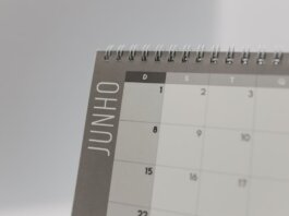 Close-up view of a spiral-bound calendar showing the month of June with a date grid.