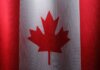 Close-up view of the Canadian flag with its iconic red maple leaf.