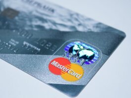 Detail shot of a MasterCard credit card, showing the chip and logo.