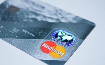 Detail shot of a MasterCard credit card, showing the chip and logo.