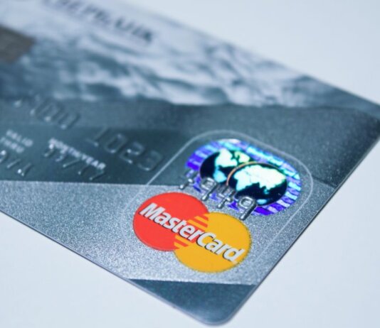Detail shot of a MasterCard credit card, showing the chip and logo.