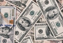 Detailed close-up of US dollar bills highlighting wealth and finance concepts.