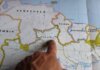 Министры иммиграции обсудили устойчивые уровни въезда в Канаду Discover Roraima, Brazil with a finger pointing on a detailed map.