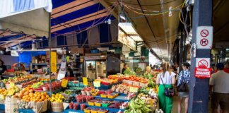 Explore a bustling street market in Quebec City showcasing fresh fruits and vegetables.