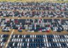 From above of rows with many contemporary different expensive automobiles on asphalt in daytime