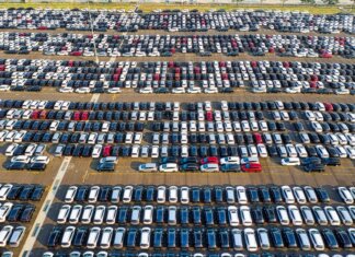 From above of rows with many contemporary different expensive automobiles on asphalt in daytime