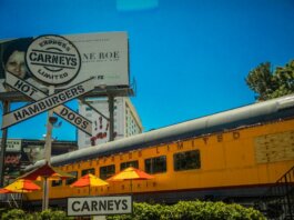 Iconic Los Angeles Carney's restaurant featuring train car dining and bold signage.