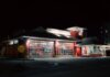 Четыре человека погибли в ДТП с возгоранием в Калгари Illuminated Gatlinburg Fire Department building at night with a dead-end sign visible.