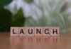 Scrabble tiles spelling 'launch' reflecting entrepreneurship and innovation.