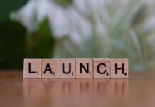 Scrabble tiles spelling 'launch' reflecting entrepreneurship and innovation.