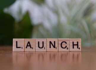 Scrabble tiles spelling 'launch' reflecting entrepreneurship and innovation.