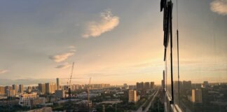 Stunning aerial sunset view of Xi'an cityscape featuring construction and urban expansion.