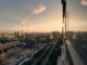 Stunning aerial sunset view of Xi'an cityscape featuring construction and urban expansion.