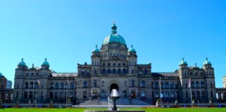 Stunning view of the British Columbia Parliament Building with clear blue sky.