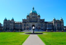 Stunning view of the British Columbia Parliament Building with clear blue sky.