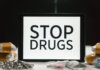 Канадская пограничная служба изъяла 86 кг наркотиков в ходе операции Tablet screen displaying anti-drug message surrounded by packaged substances, promoting awareness.