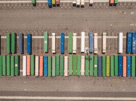 Top view of neatly arranged cargo containers in a shipping port, highlighting logistics and global trade.