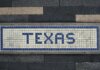 Meta поддерживает стандарты дата-центров губернатора Техаса Unique mosaic tile artwork spelling 'Texas' on a sidewalk in Houston, TX.