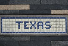 Meta поддерживает стандарты дата-центров губернатора Техаса Unique mosaic tile artwork spelling 'Texas' on a sidewalk in Houston, TX.