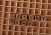 Канада следит за ситуацией после наводнений в Непале и Китае Wooden letter blocks spelling Latest News on a grid background, ideal for media themes.