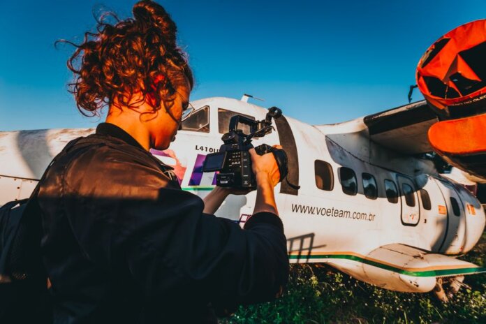 A photographer captures an aircraft on a sunny day in Rio de Janeiro. A photographer captures an aircraft on a sunny day in Rio de Janeiro.