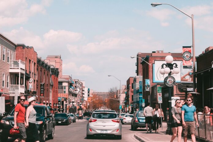 Bustling day in downtown Ottawa captures pedestrians, historic buildings, and lively street life. Bustling day in downtown Ottawa captures pedestrians, historic buildings, and lively street life.