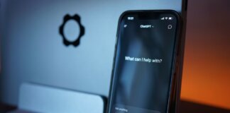 Close-up of a smartphone with AI chat interface, showcasing advanced technology in a sleek design.