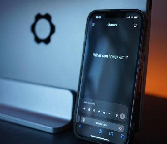 Close-up of a smartphone with AI chat interface, showcasing advanced technology in a sleek design.