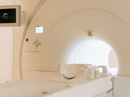 Close-up view of a modern CT scanner in a healthcare facility.