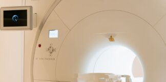 Close-up view of a modern CT scanner in a healthcare facility.