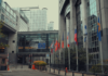 Exterior view of European Parliament with EU flags in Brussels