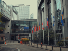 Exterior view of European Parliament with EU flags in Brussels