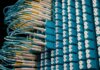 From below of fiber optic equipment with similar colorful rubber cables and round sockets